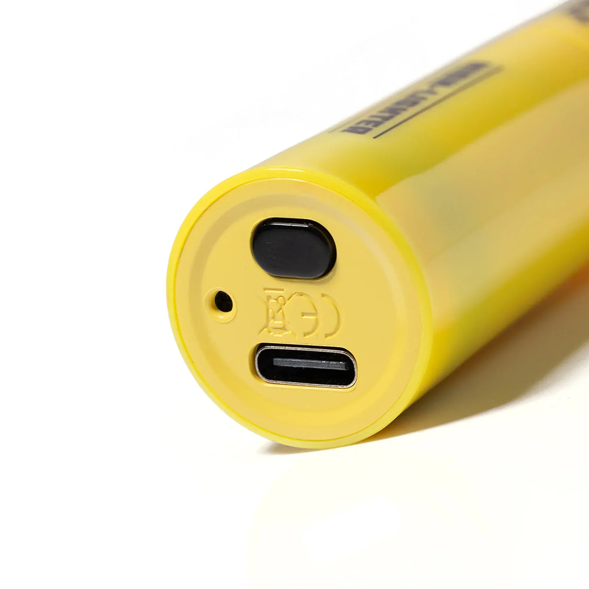 Close-up of yellow rechargeable device with USB-C charging port on white background