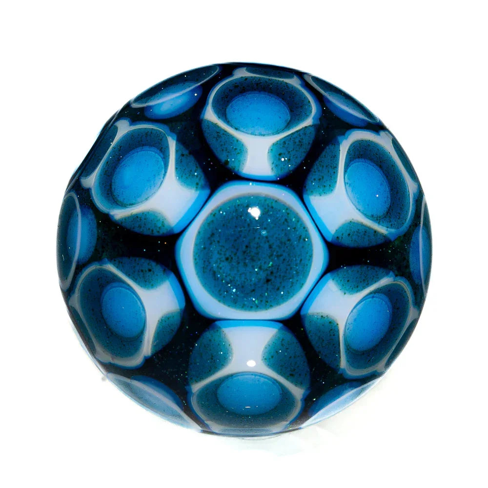 Handcrafted glass marble with blue honeycomb pattern and glitter accents