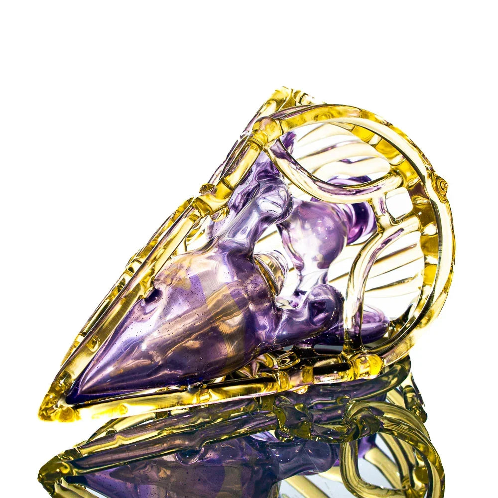 Purple and yellow artistic glass pipe with intricate skull design on white background