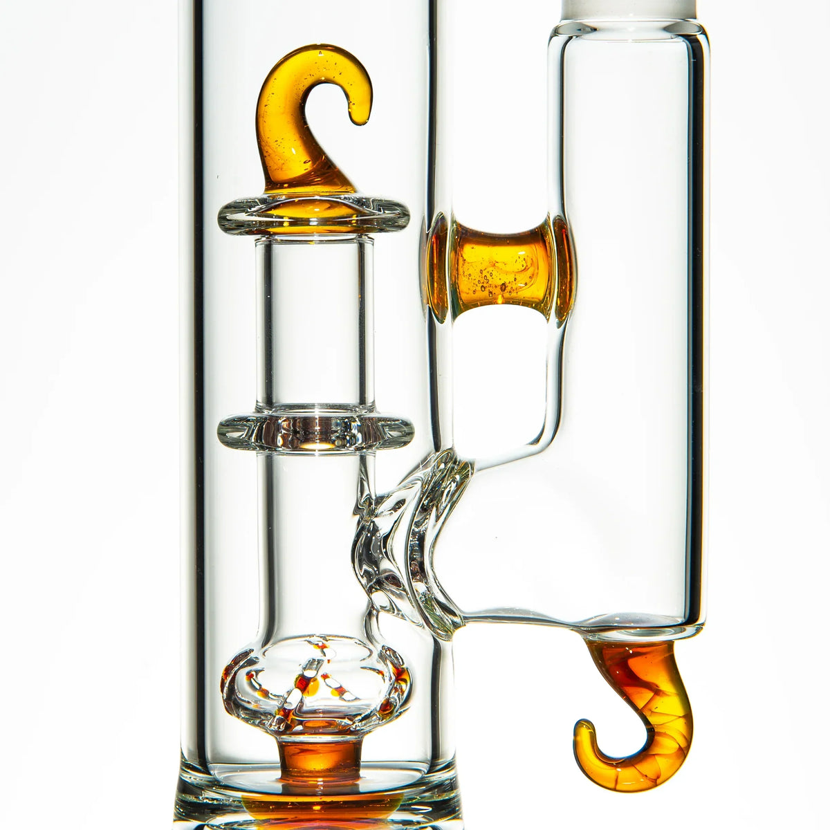 Clear glass water pipe with gold hook accents and intricate percolator design