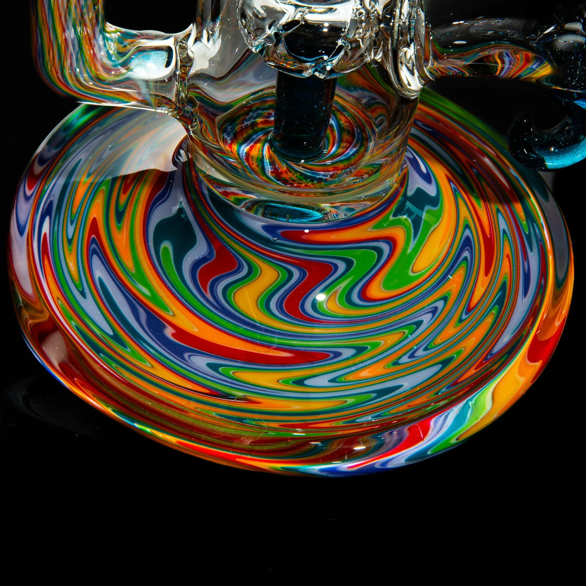 Heady glass water pipe with vibrant rainbow swirl patterns on the base