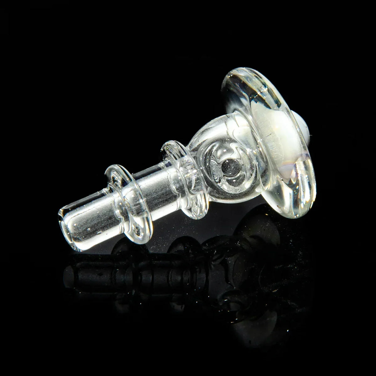 Clear glass attachment set with detailed accents on black background, heady glass accessory