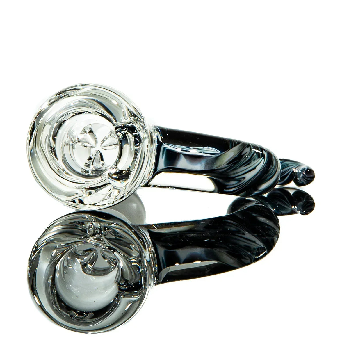 Clear glass hand pipe with black accents and unique spiral details, reflected on white surface.
