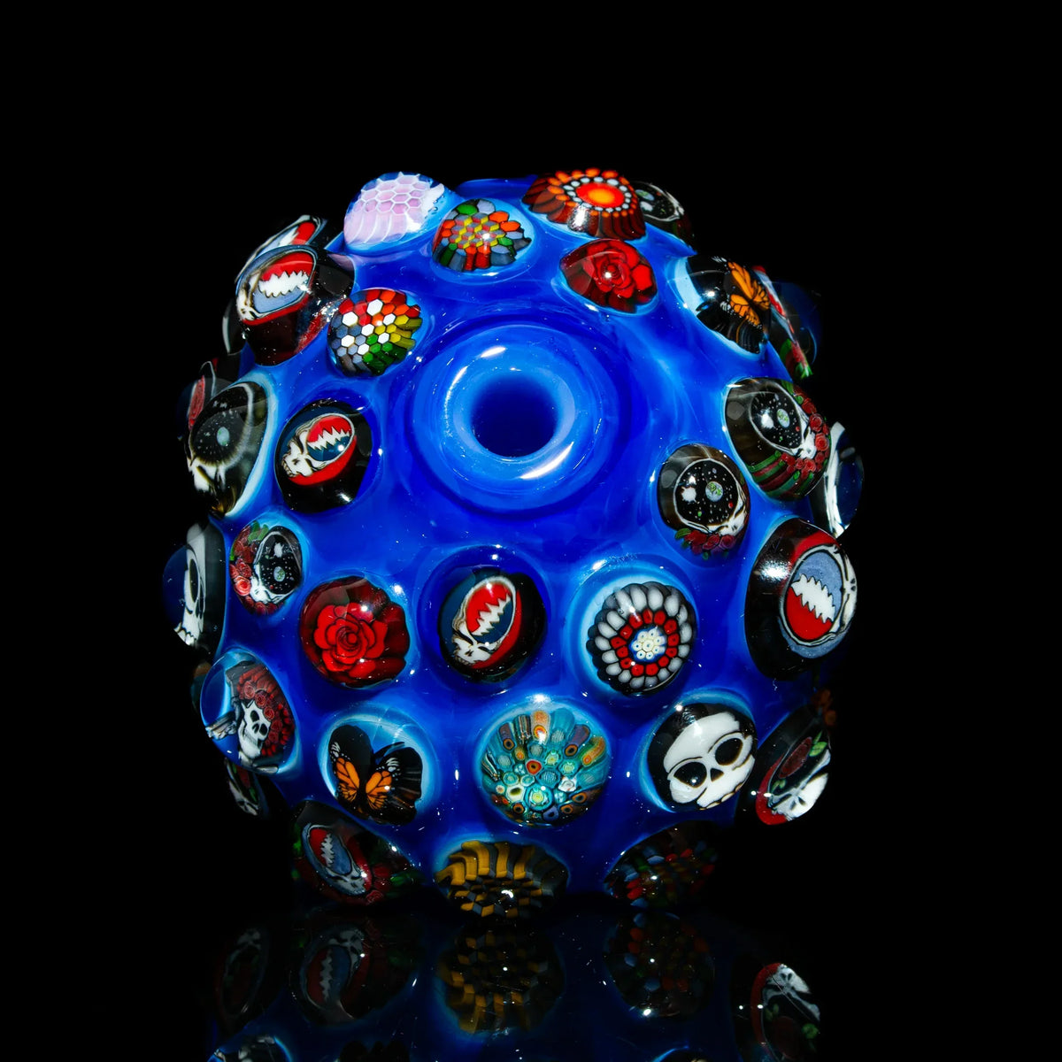 Blue heady glass piece with colorful skull, rose, and butterfly millie designs