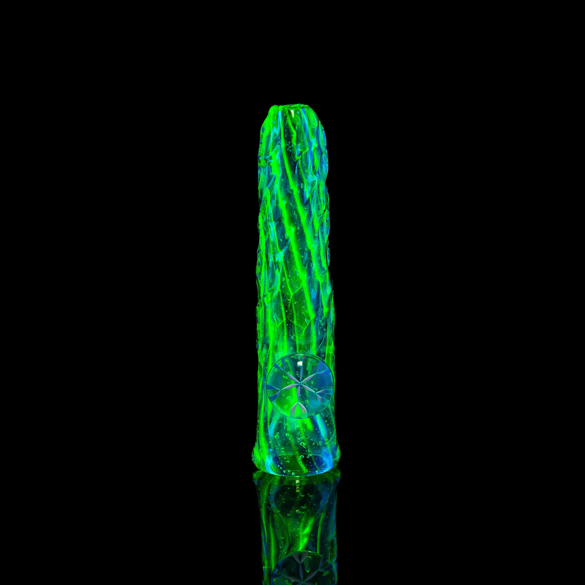 UV-reactive green and blue textured glass chillum pipe on black background