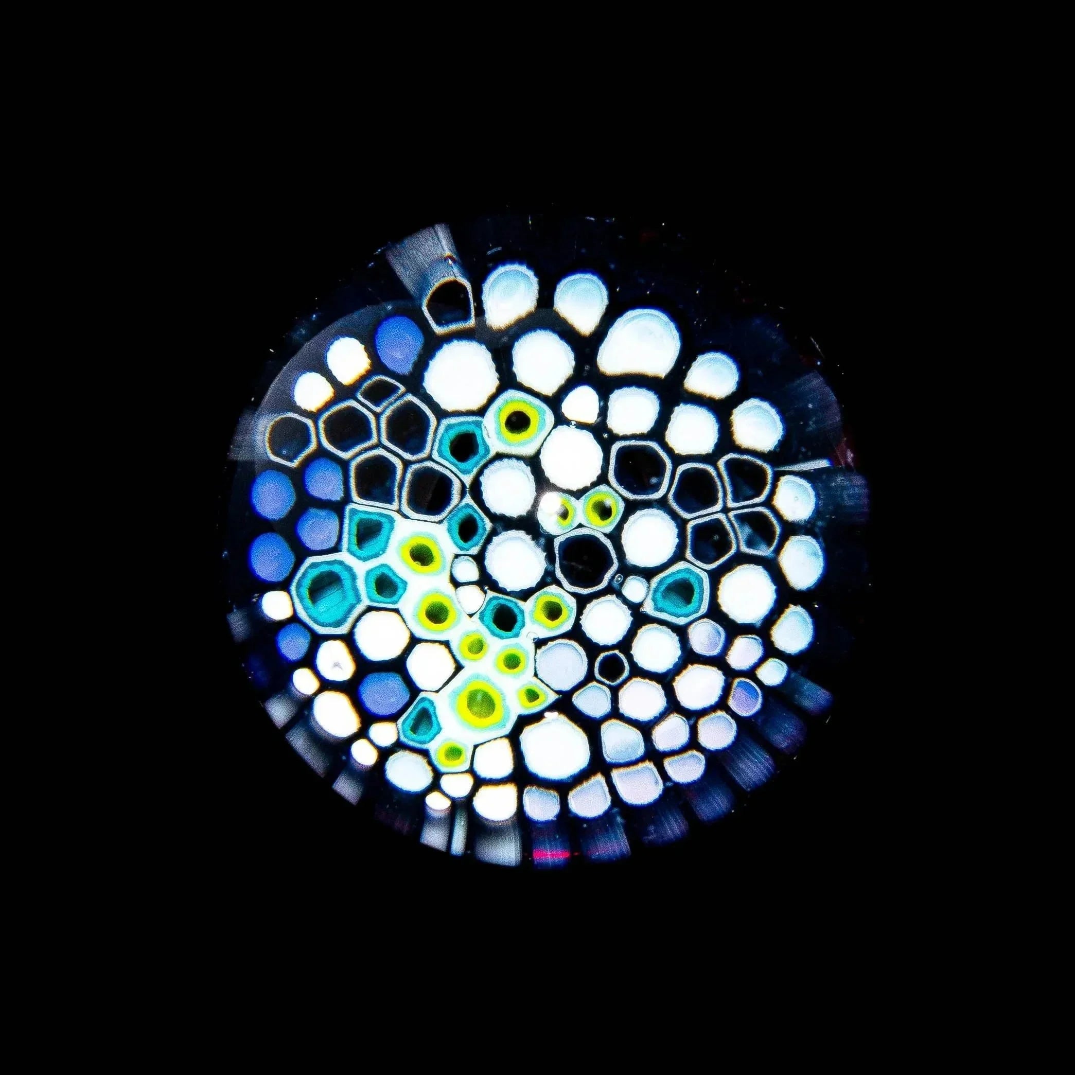 colorful honeycomb pattern glass art marble on black background