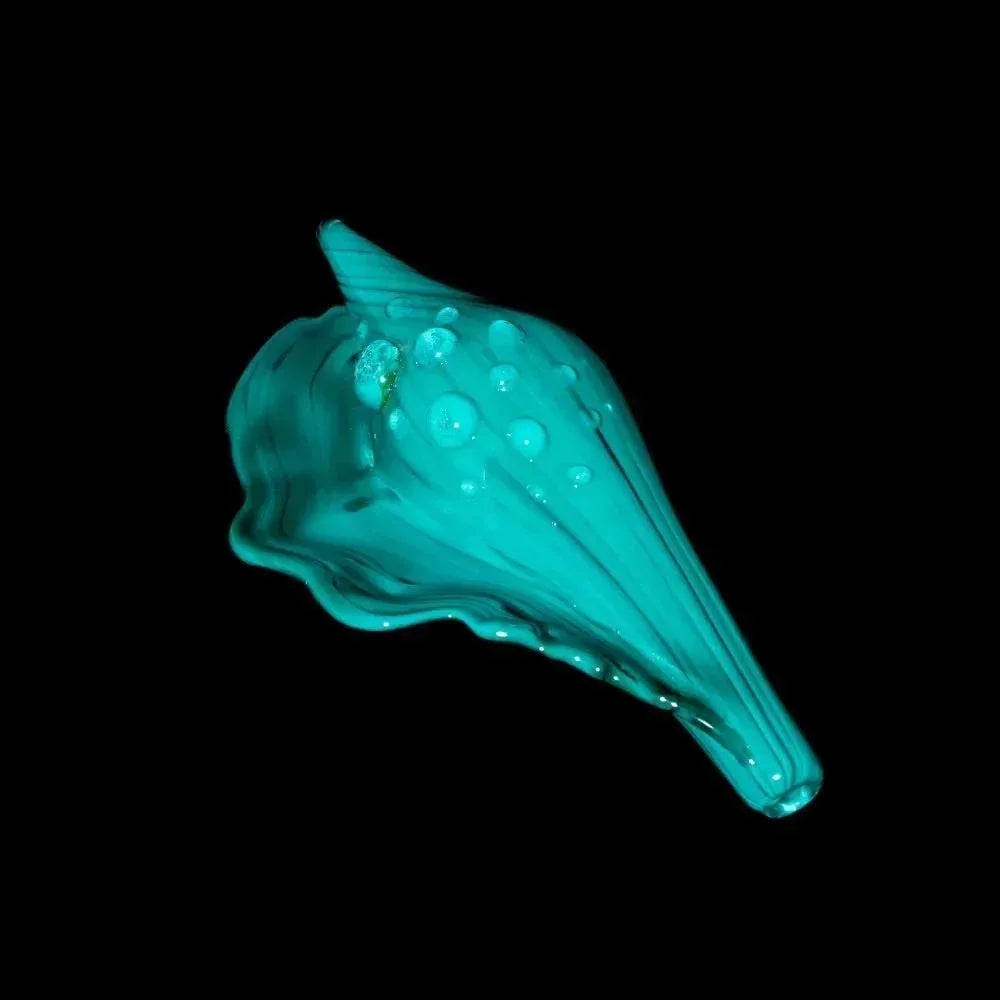 Teal glass seashell-shaped pipe with textured bubbles, displayed on a black background.