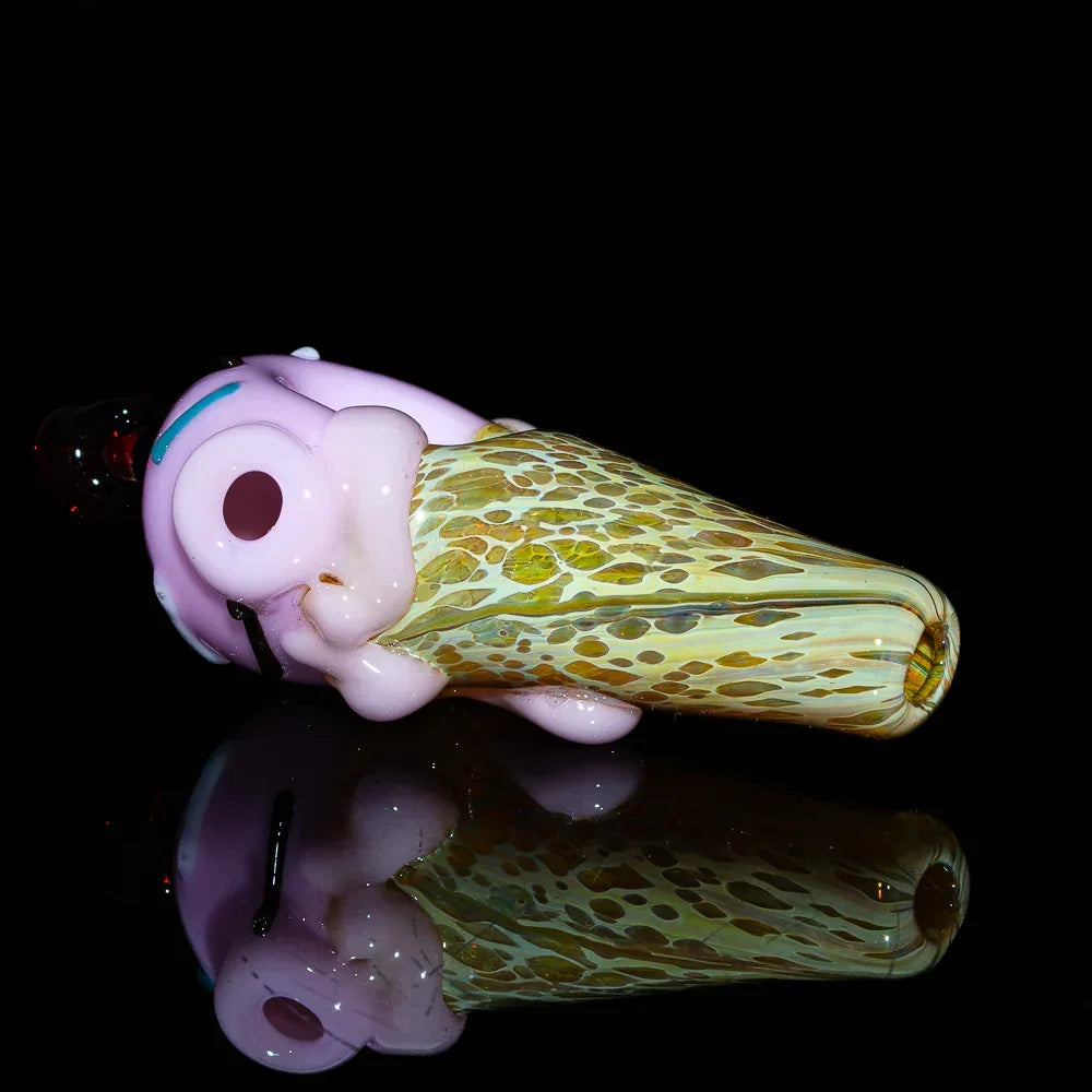 Handcrafted glass spoon pipe shaped like a strawberry ice cream cone on black background