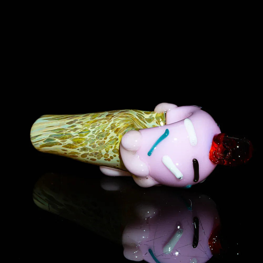 Glass spoon pipe shaped like a strawberry ice cream cone with colorful sprinkle accents