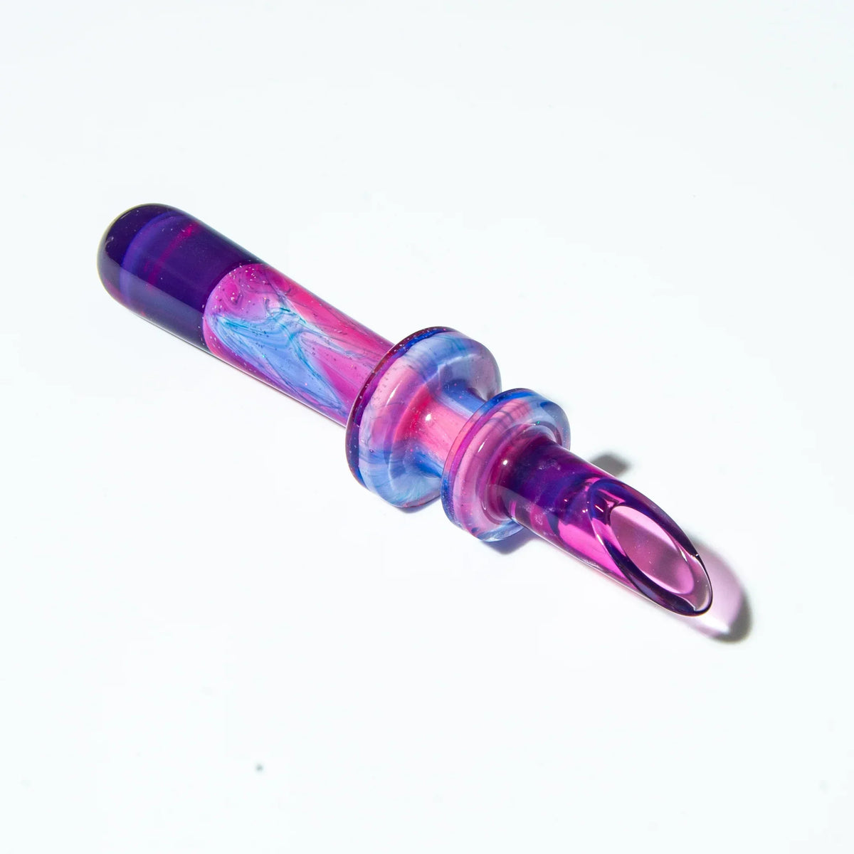 Colorful glass dab tool with pink, blue, and purple swirls on a white background.