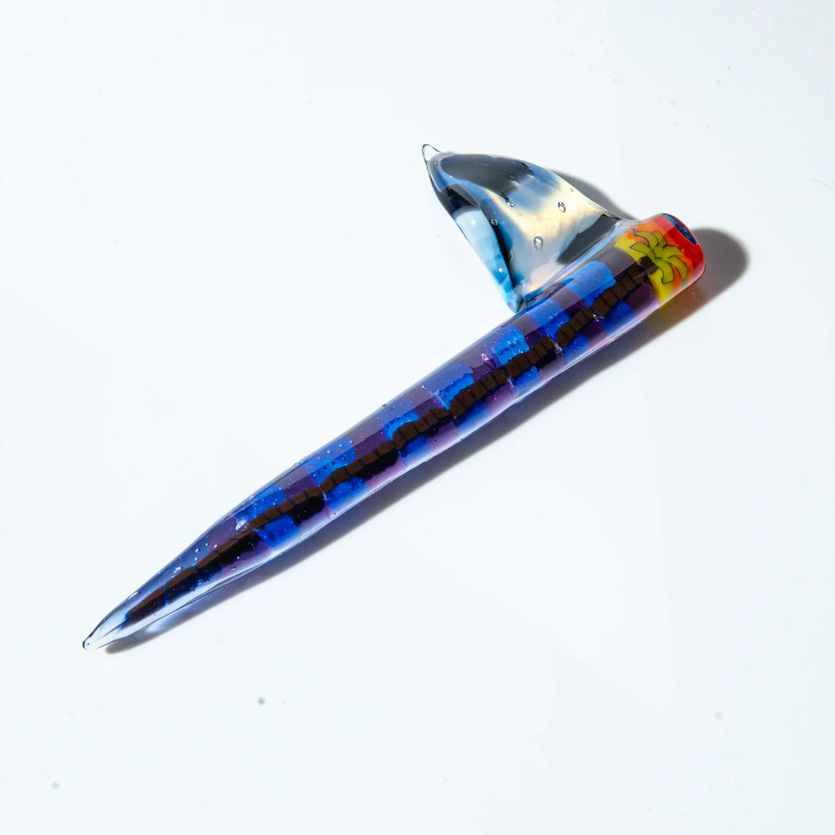 Colorful glass dab tool with blue and red pattern, unique sculpted design on white background