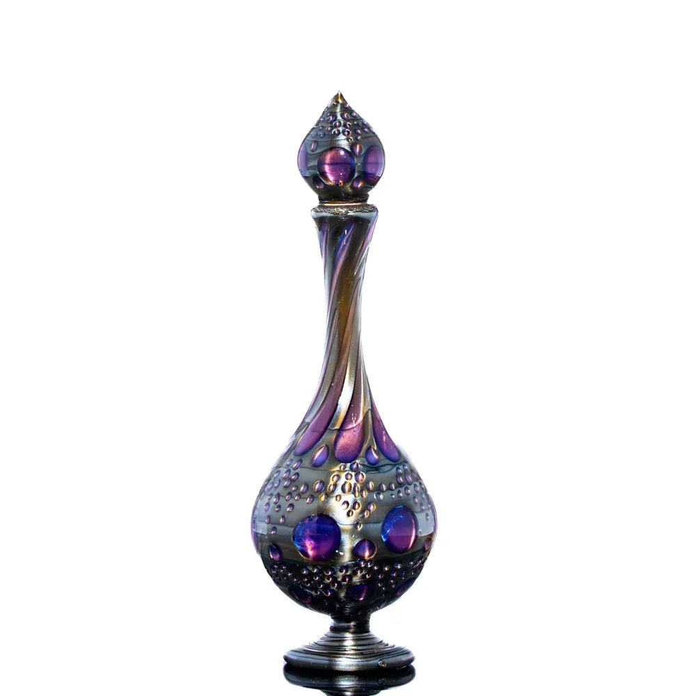 Artistic glass decanter with iridescent purple and gold bubbles, displayed on white background