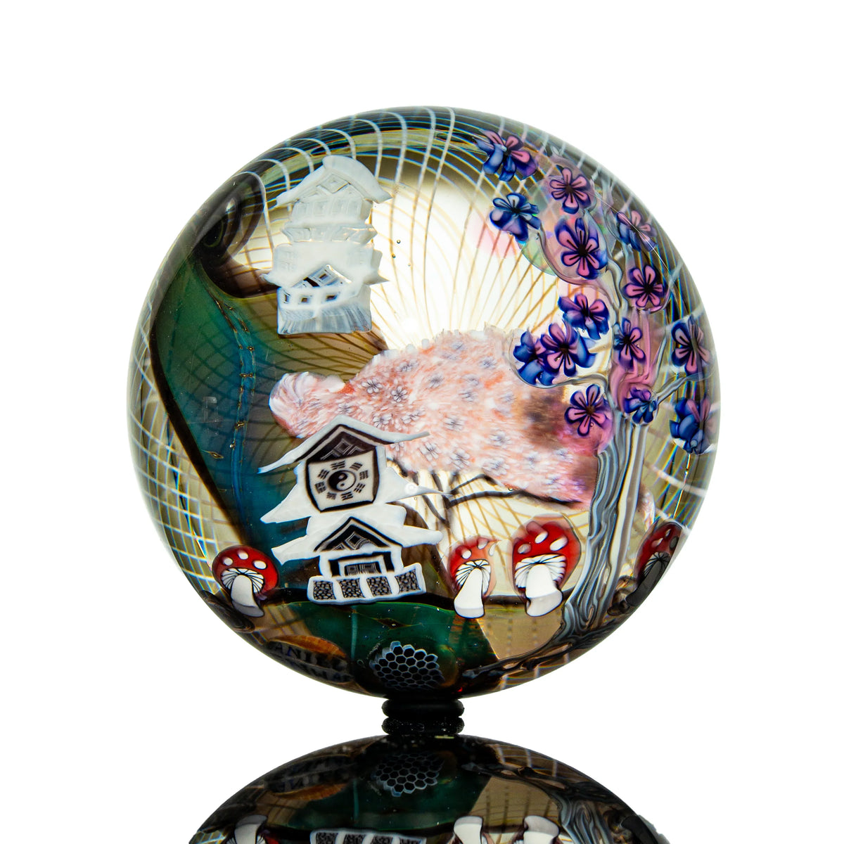 Hand-blown glass marble with a castle design by Piper Dan