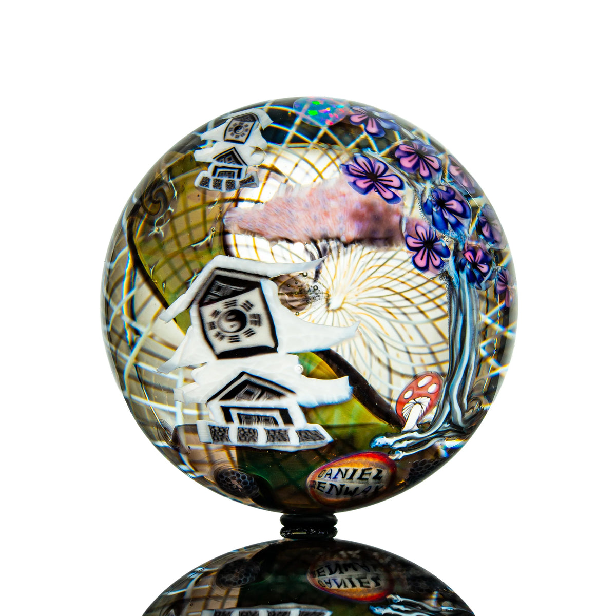 Hand-blown glass marble with a castle design by Piper Dan