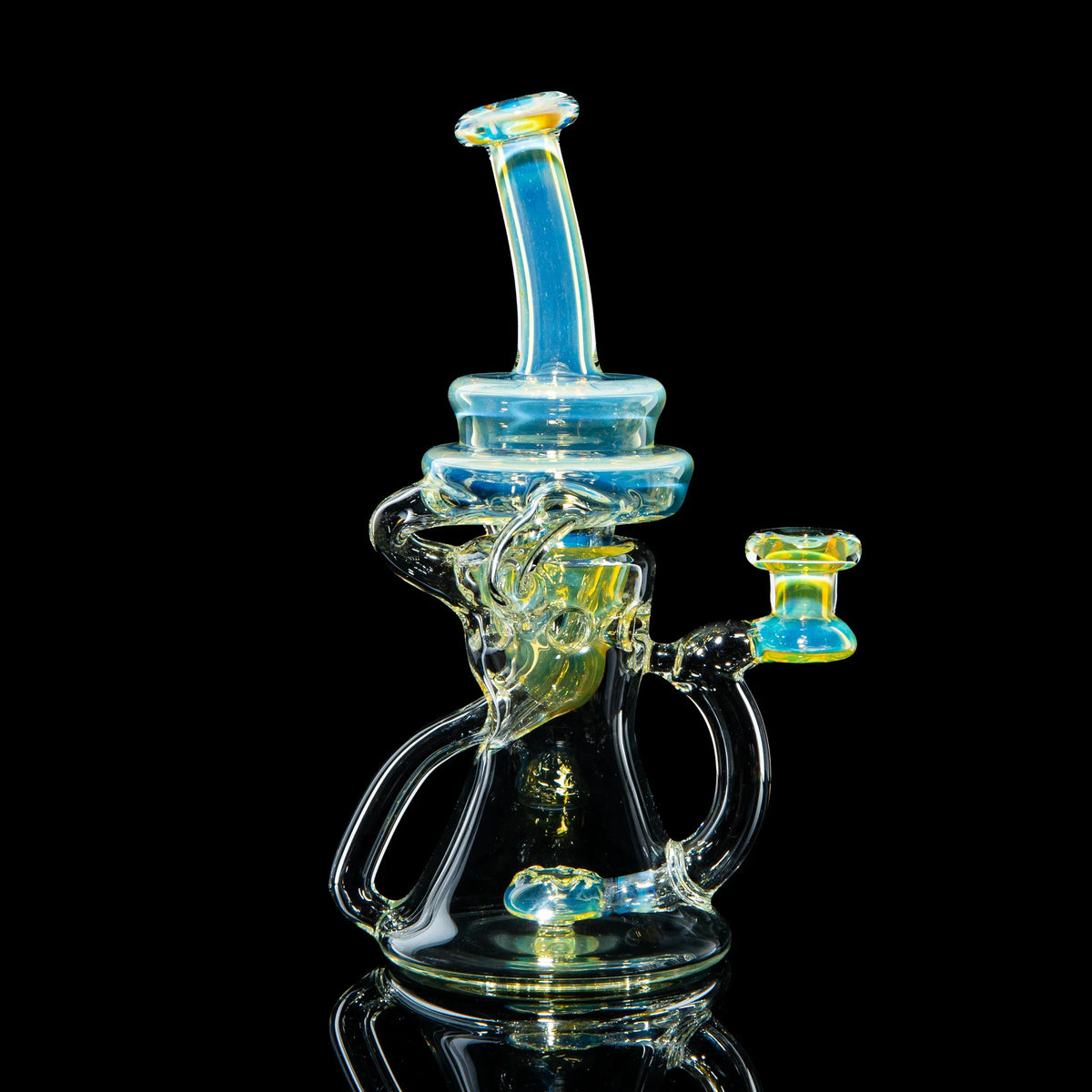Heady glass water pipe with blue and yellow accents against a black background