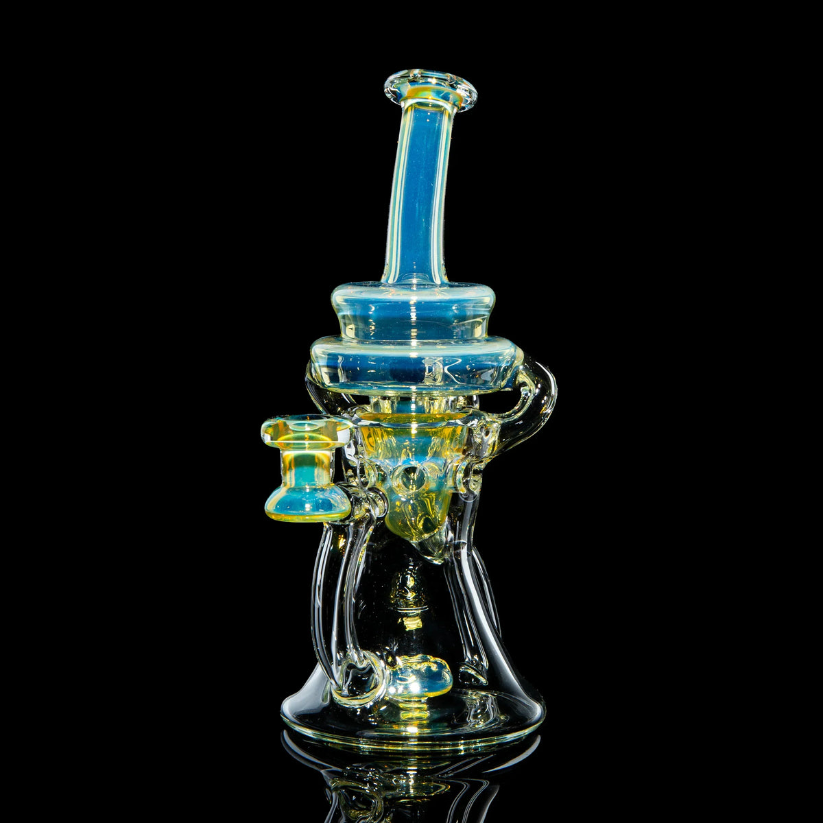 Heady glass water pipe with blue and yellow accents on black background
