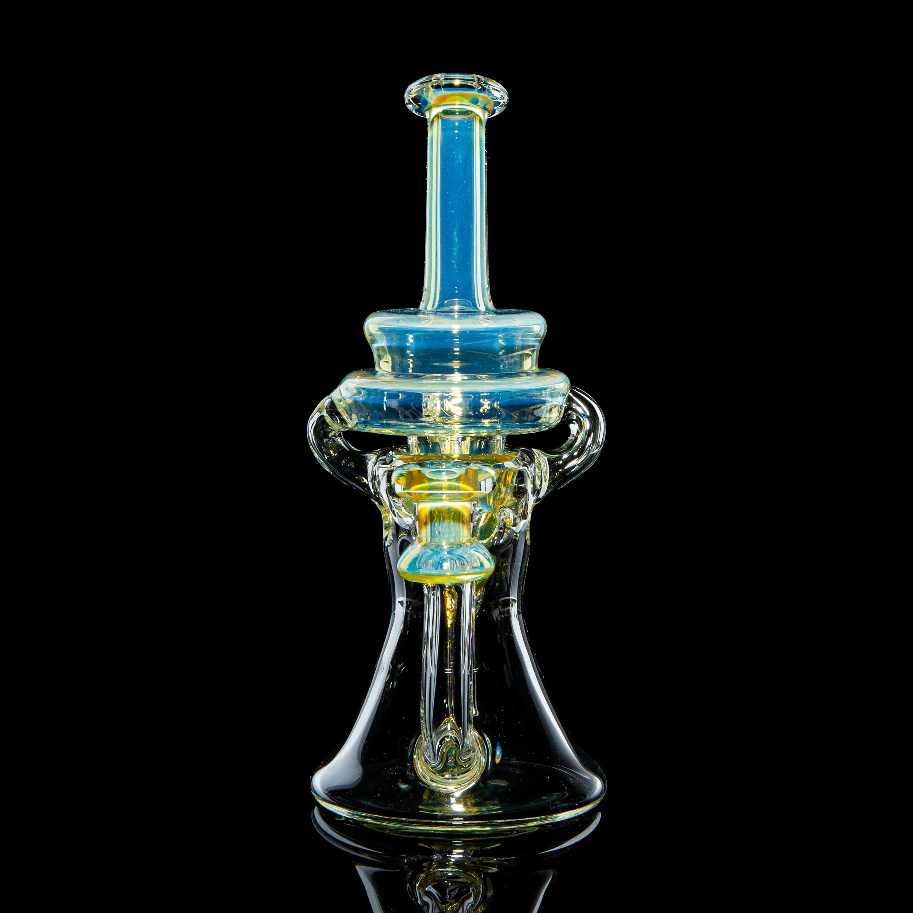 Heady glass water pipe with blue and yellow accents on a black background