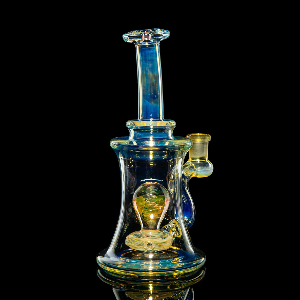 Heady art glass water pipe with iridescent colors on a black background