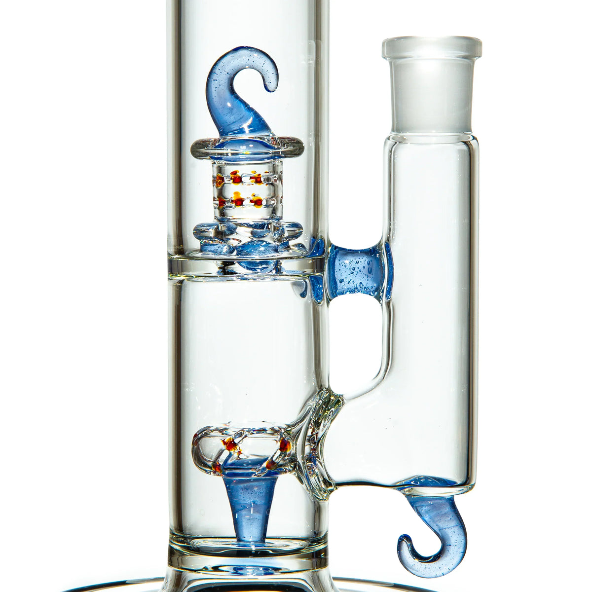 Close-up of a clear glass water pipe with blue swirl accents and decorative percolator beads