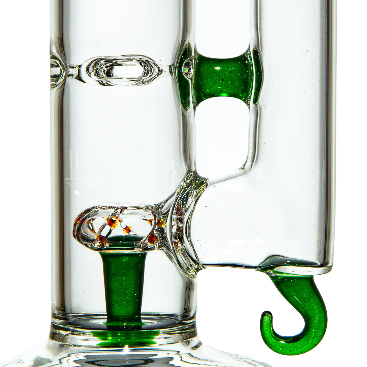 Close-up of artistic glass water pipe with green accents and intricate percolator detail