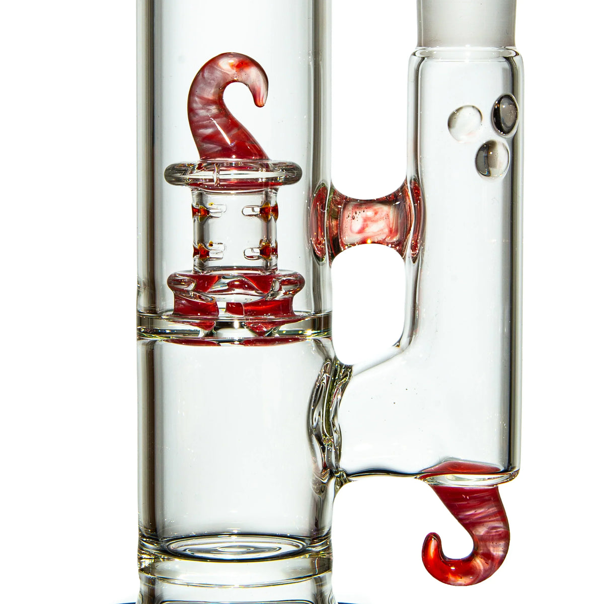 Clear glass water pipe with red hook-shaped percolator and accent details
