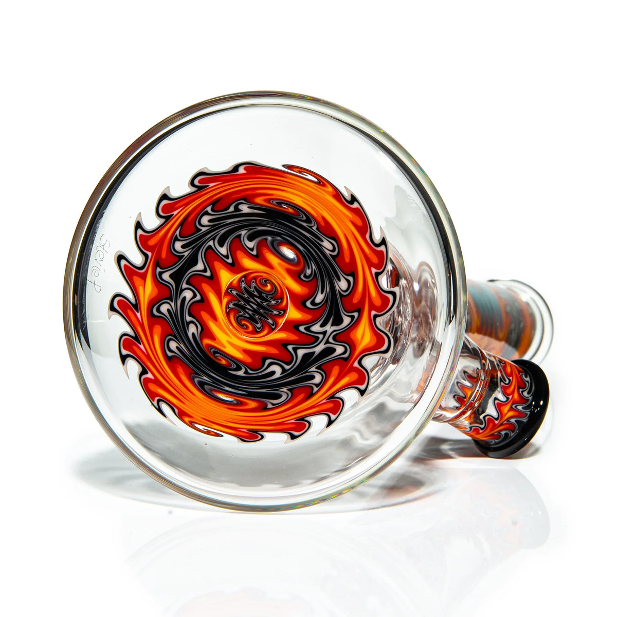 Heady glass bong with vibrant orange, red, and black spiral flame pattern on base