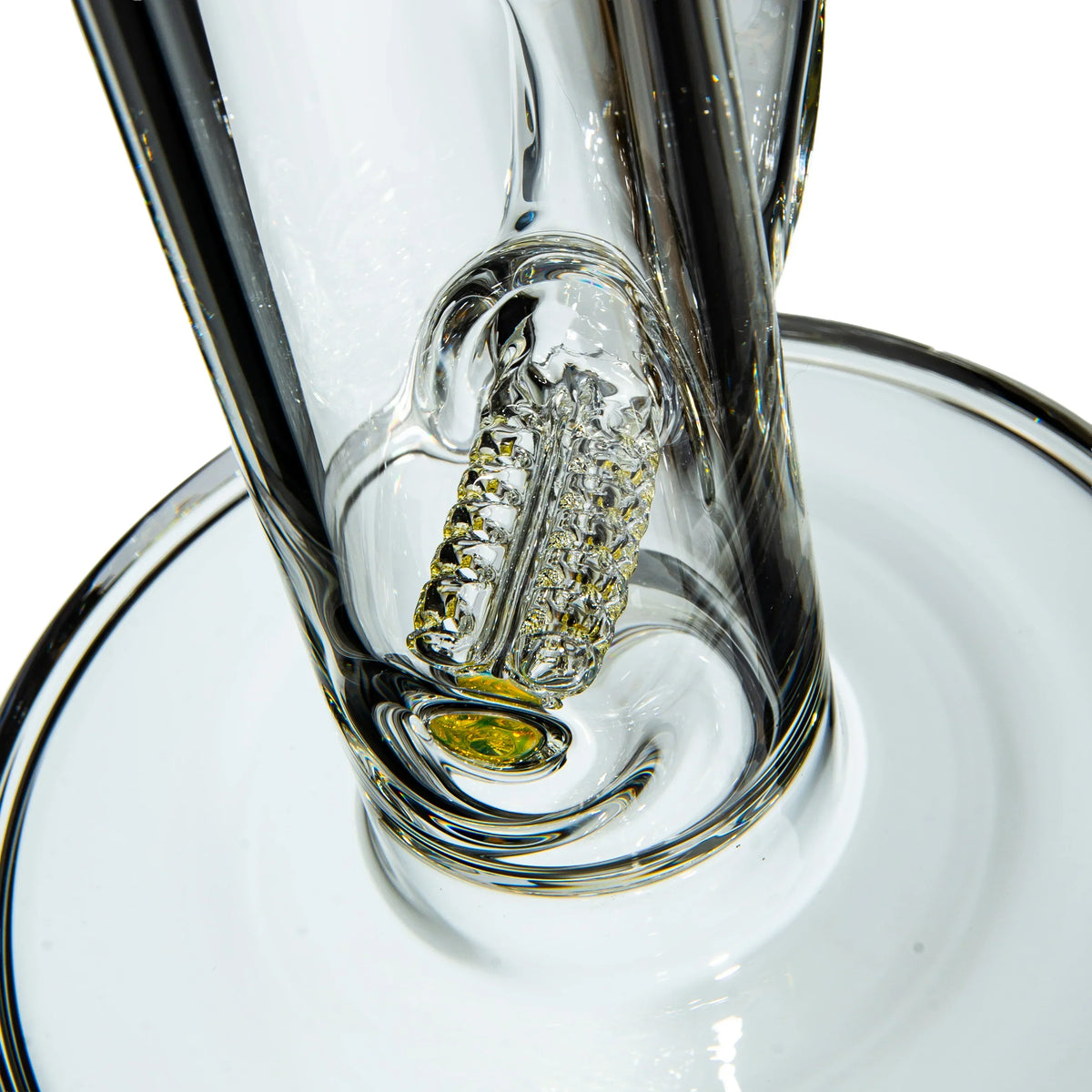 Close-up of a clear glass water pipe with a detailed percolator and yellow accent