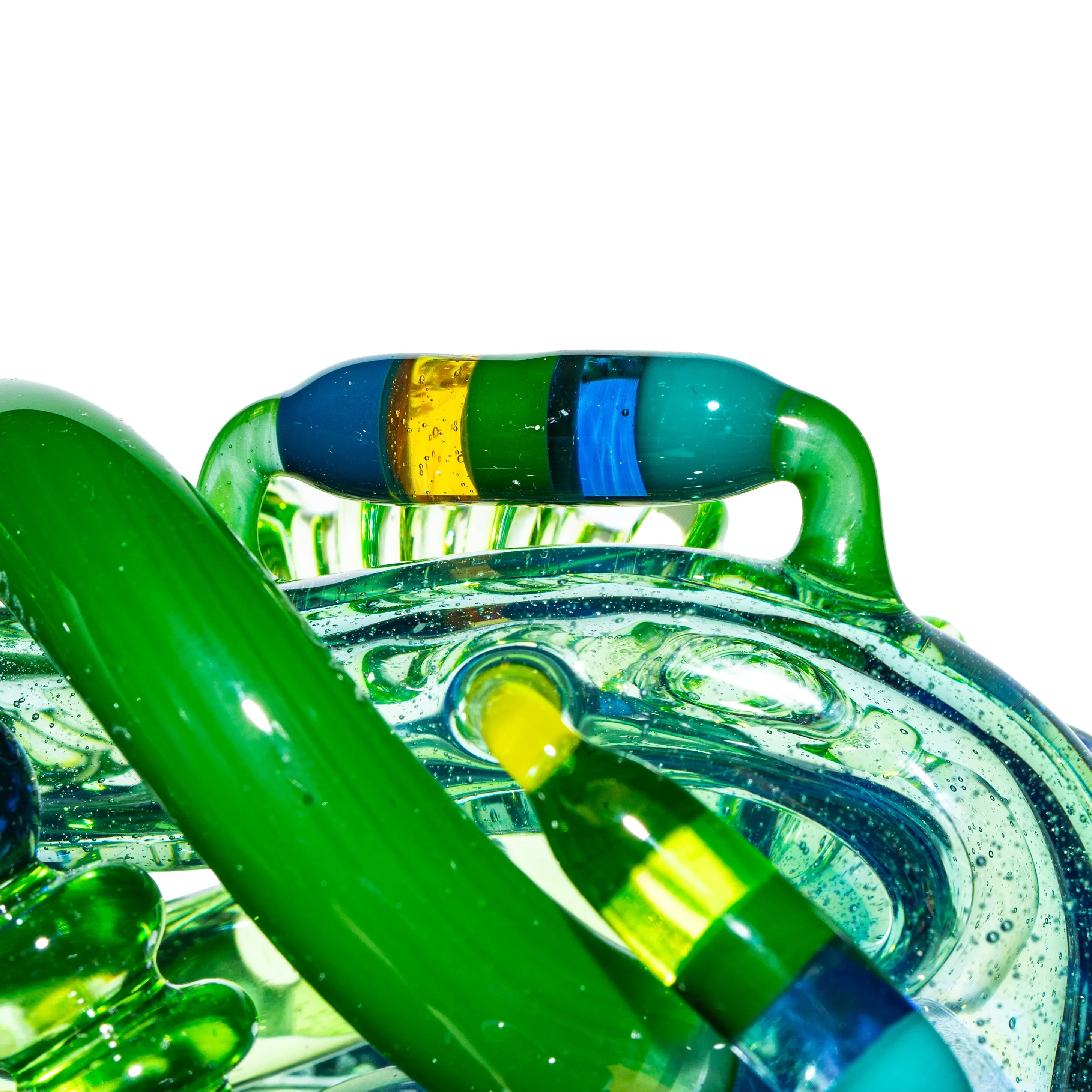 Close-up of intricate blue and green heady glass pipe with colorful accents