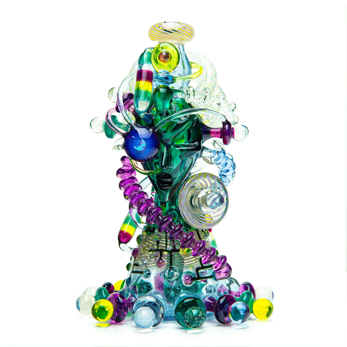 Colorful artistic glass sculpture with face design and intricate swirls on white background