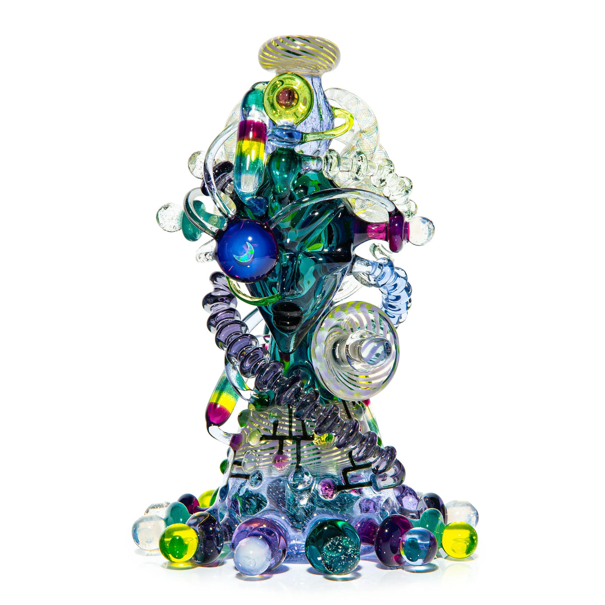 Intricate heady glass art piece with vibrant colors, marbles, and sculpted face design.