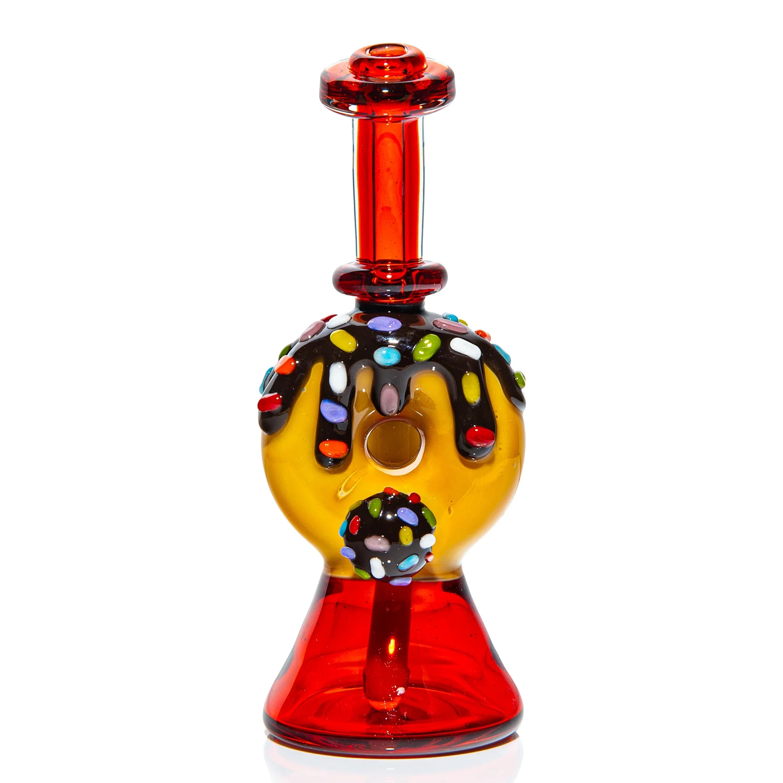 Colorful donut-shaped glass dab rig with chocolate and sprinkle detail, red base