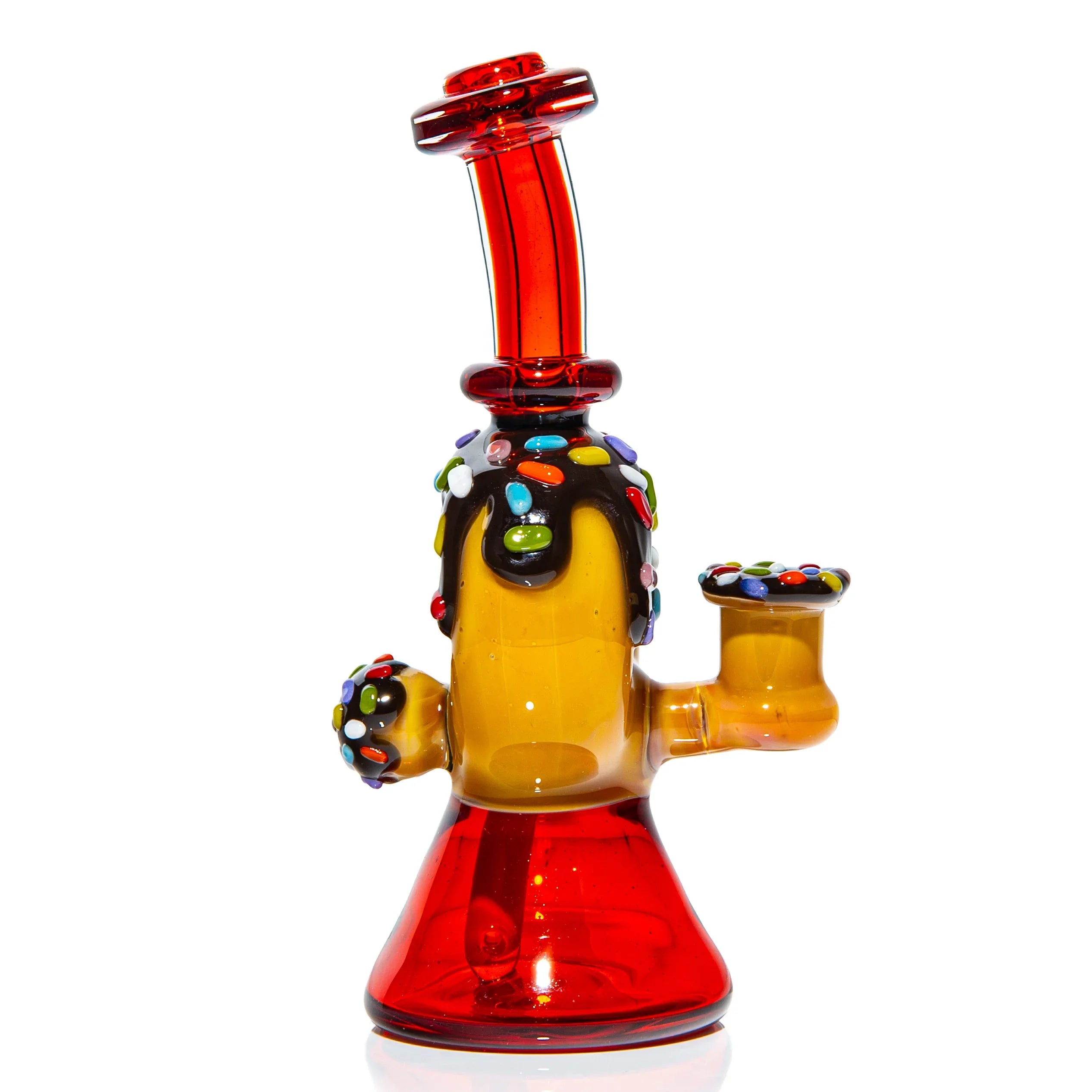 Colorful glass water pipe with candy sprinkle accents and red base on white background