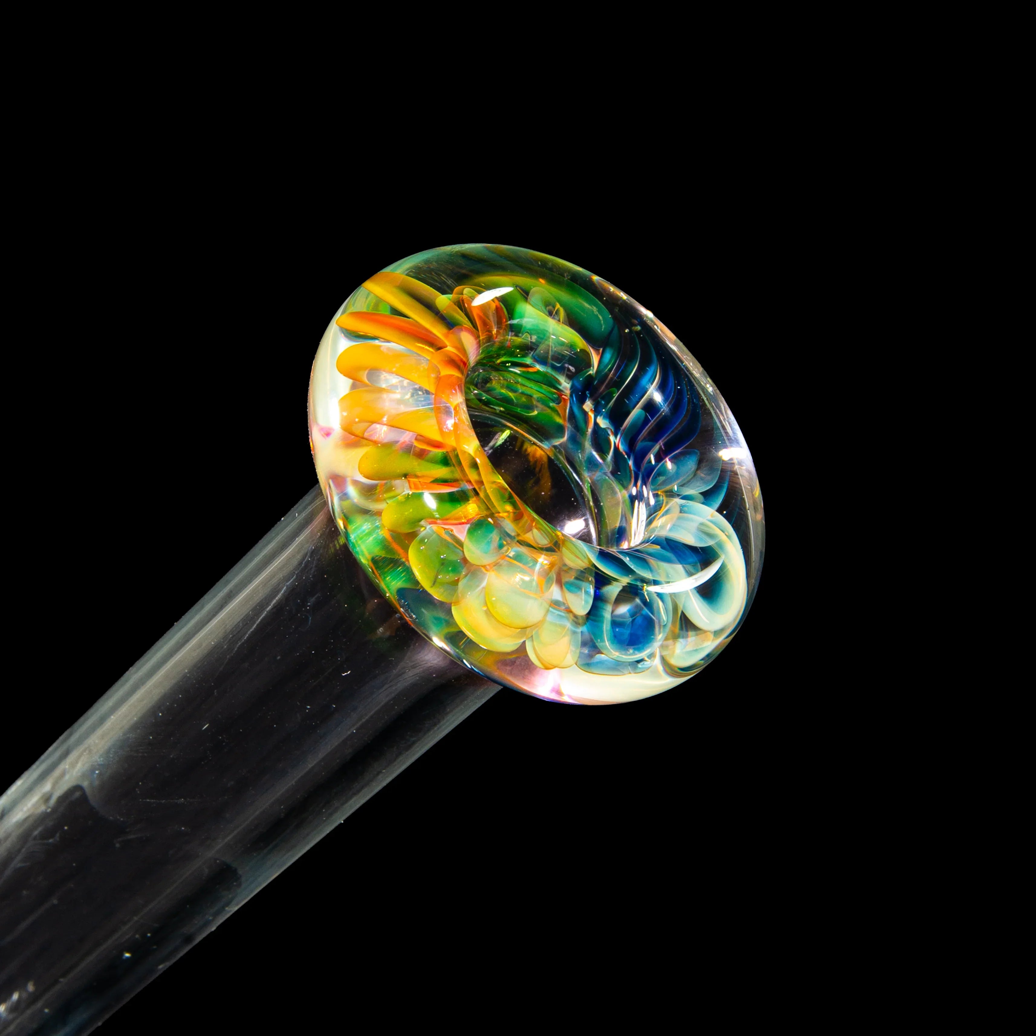 Hand-blown glass pipe with vibrant rainbow swirl design on black background