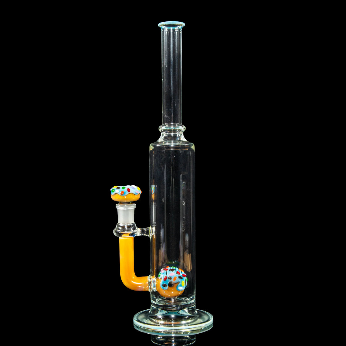 Clear glass water pipe with donut-themed accents and colorful sprinkles on black background