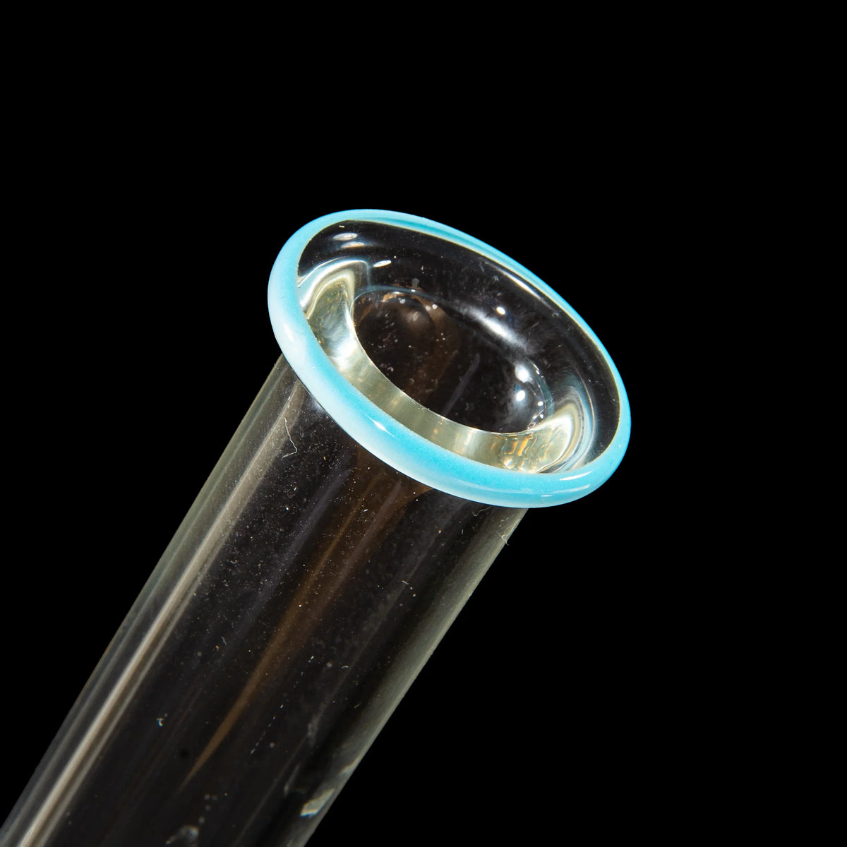 Close-up of clear glass tube with blue-accented mouthpiece on black background