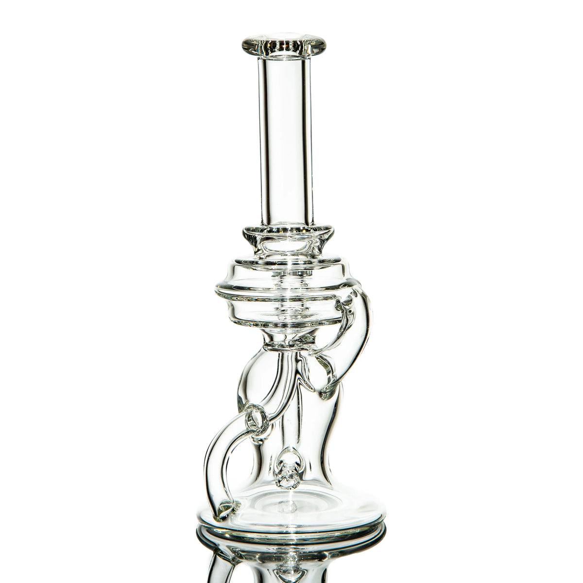 Clear heady glass water pipe with intricate recycler design on white background