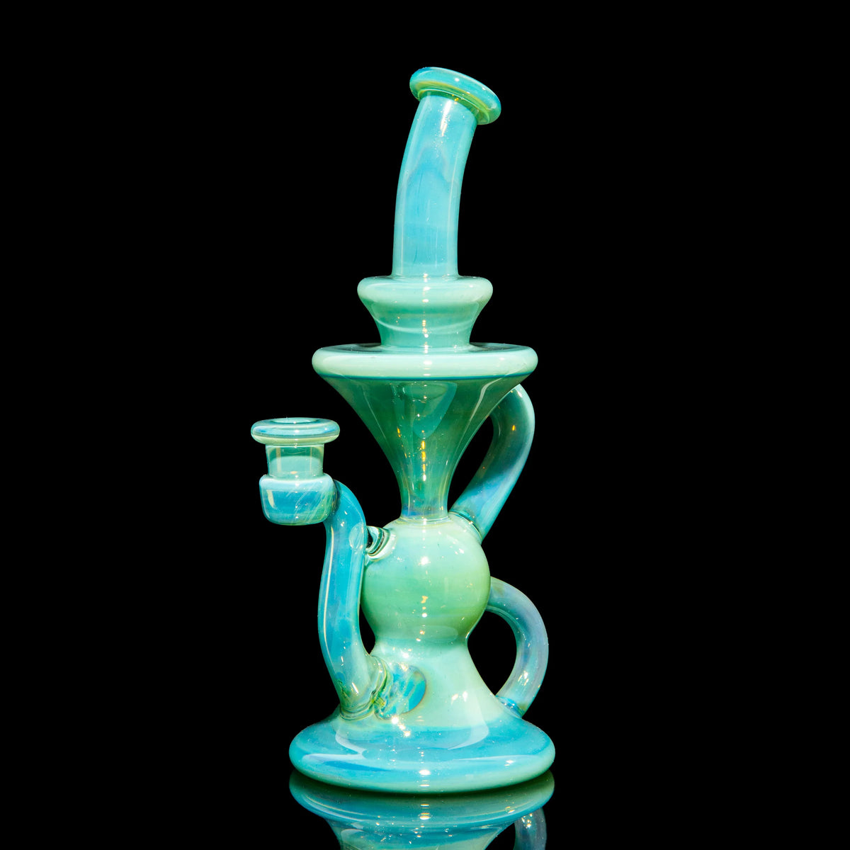 Artistic aqua blue glass water pipe with intricate curves, displayed on black background.