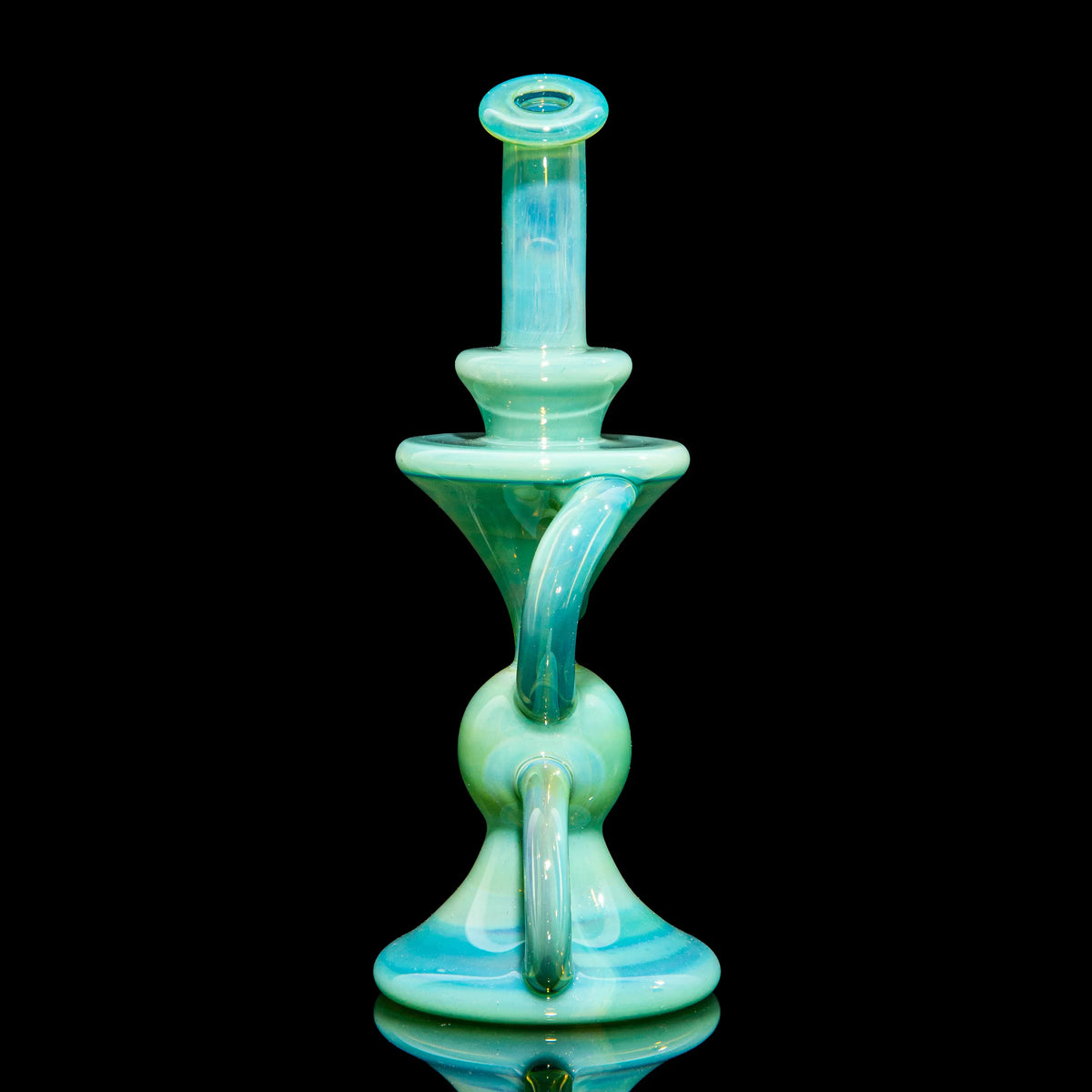 Aqua blue recycler glass water pipe with unique curving design on black background