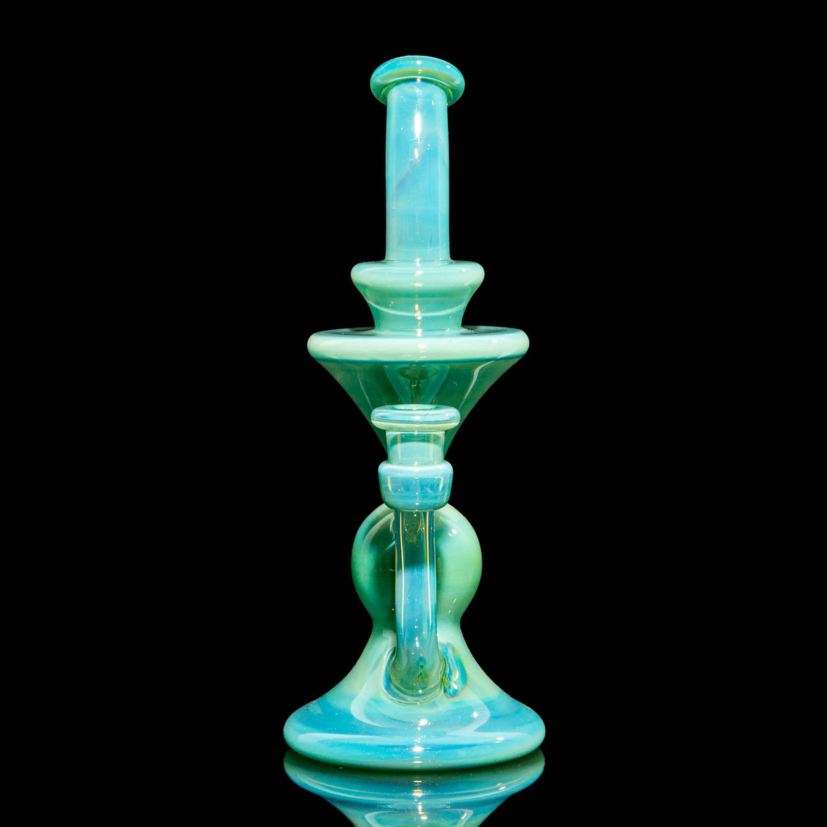 Aqua blue heady glass water pipe with unique artistic design on a black background.