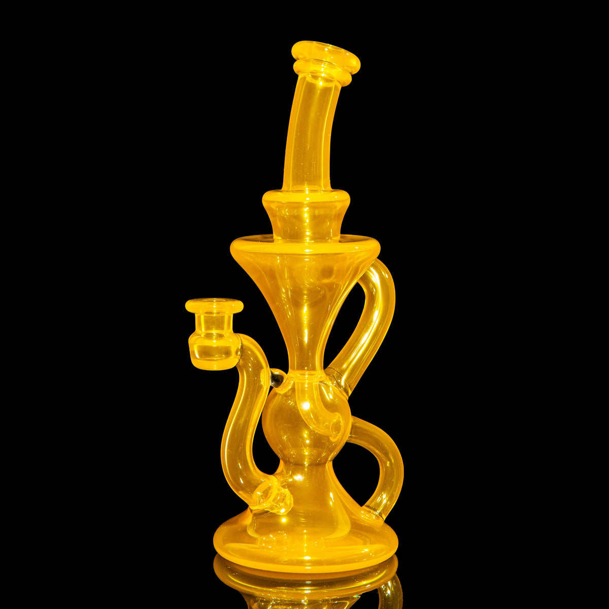 Yellow heady glass water pipe with artistic curves on black background