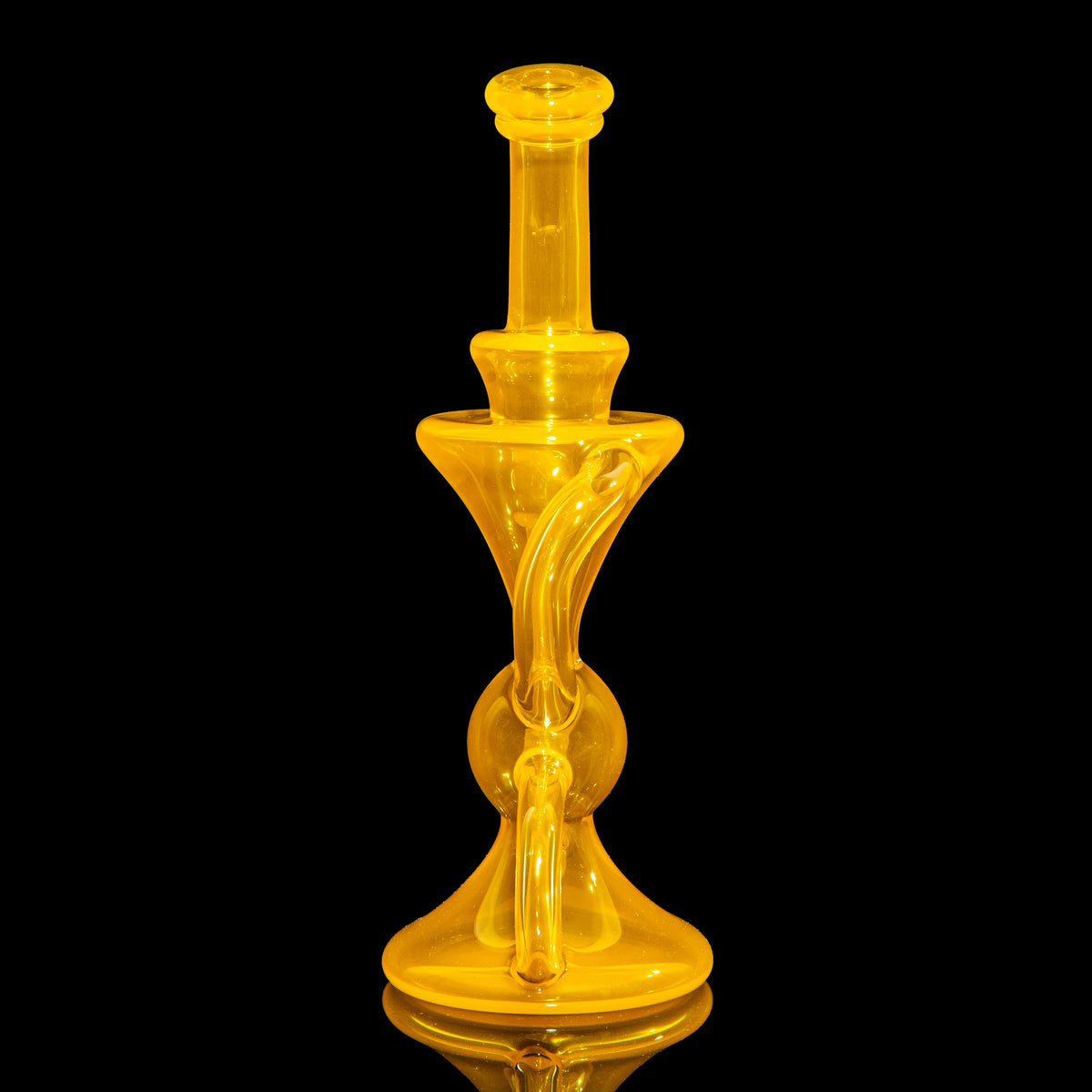 Yellow heady glass water pipe with unique curves on a black background