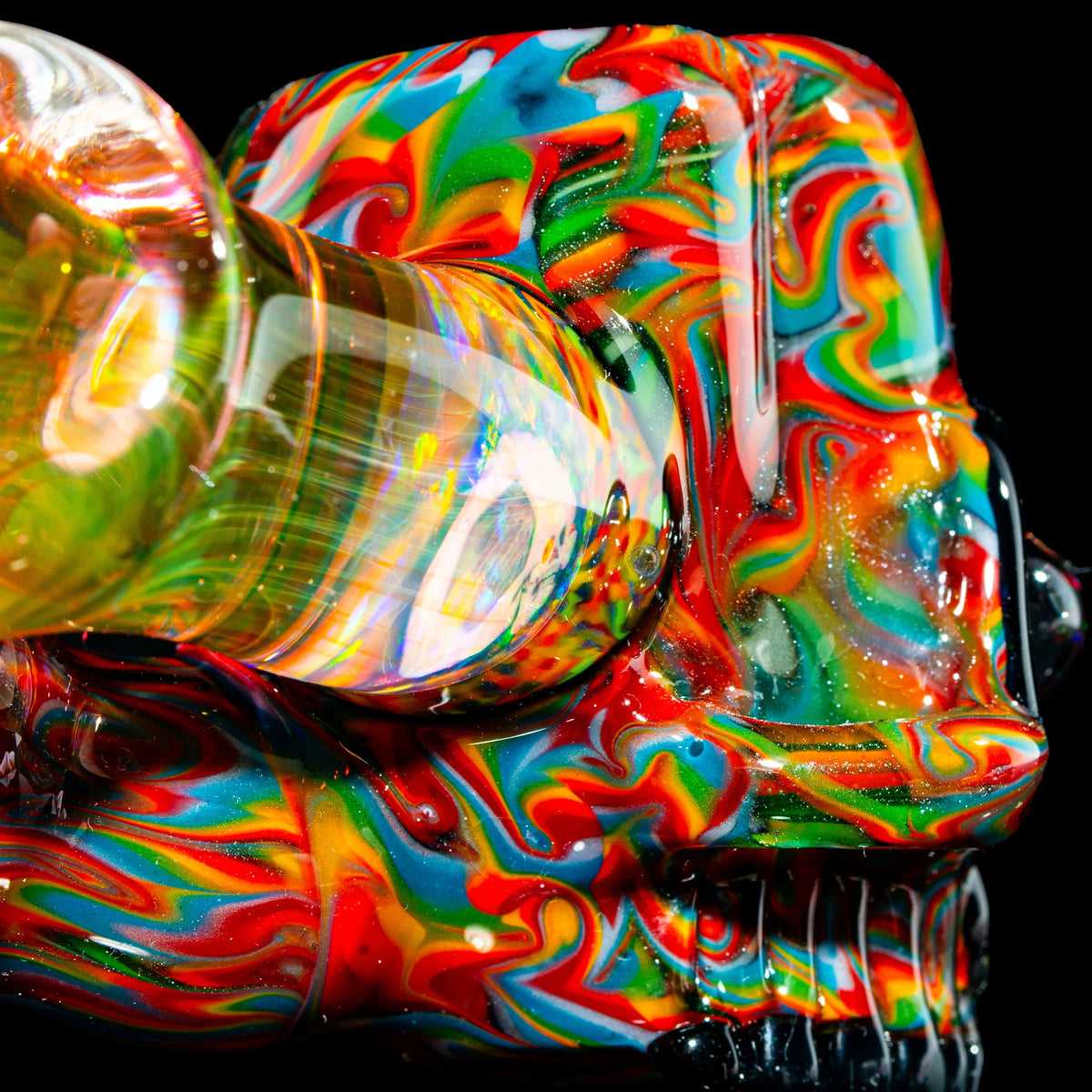 Close-up of a colorful psychedelic glass pipe with swirling rainbow patterns