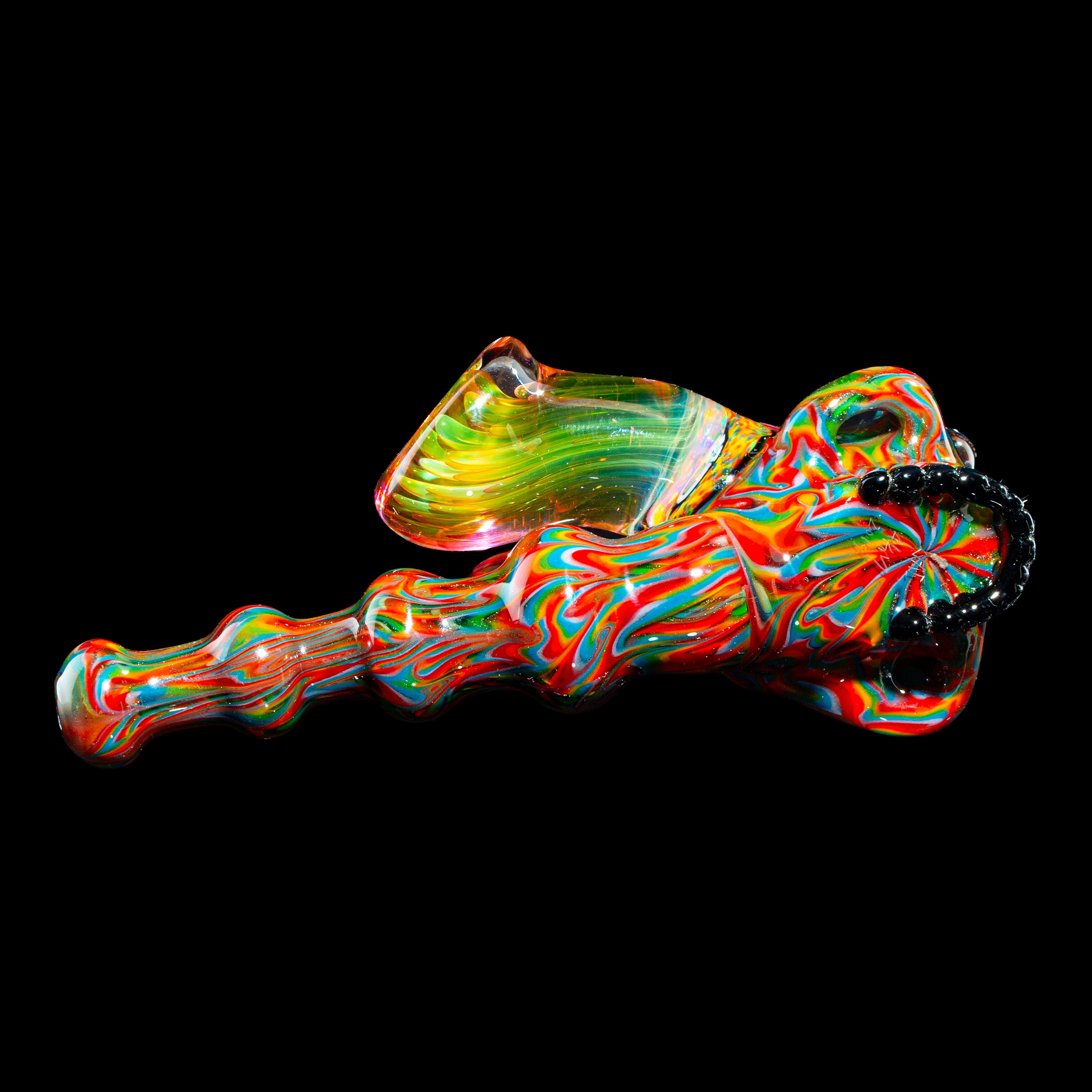 Colorful hand-blown glass pipe with vibrant swirling patterns on a black background