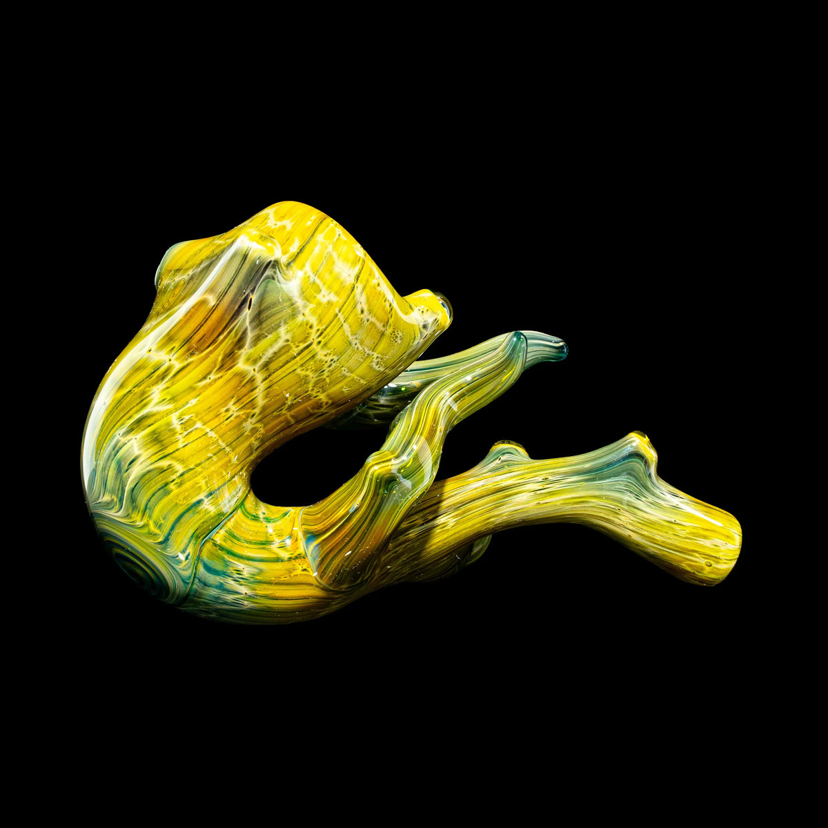 Hand-blown yellow and green glass pipe with wood grain texture on black background