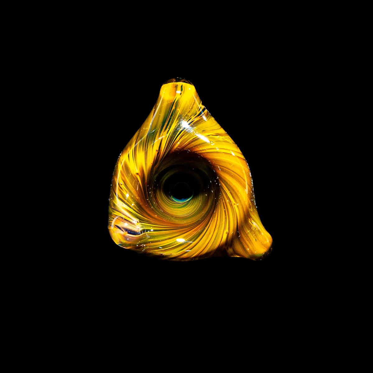Hand-blown yellow glass art piece with spiral pattern, displayed on a black background.