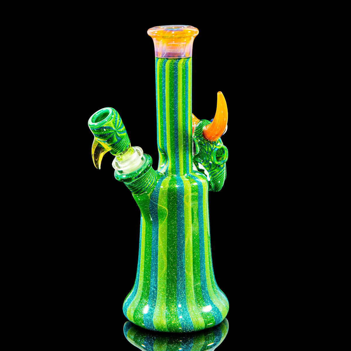 Colorful striped glass water pipe with orange accent horns on black background