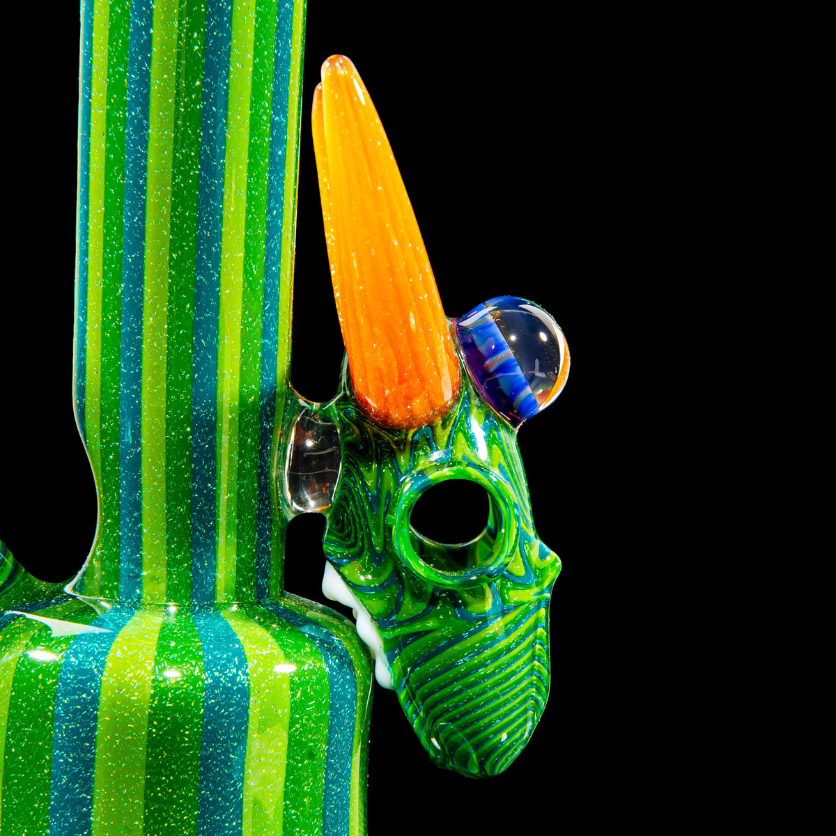 Colorful striped glass bong with green and blue dragon head design and orange horn attachment