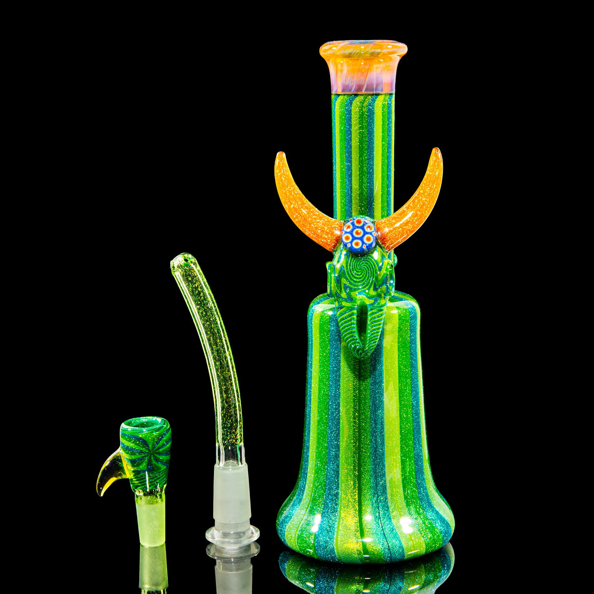 Colorful heady glass water pipe with striped green body, orange horns, and matching accessories