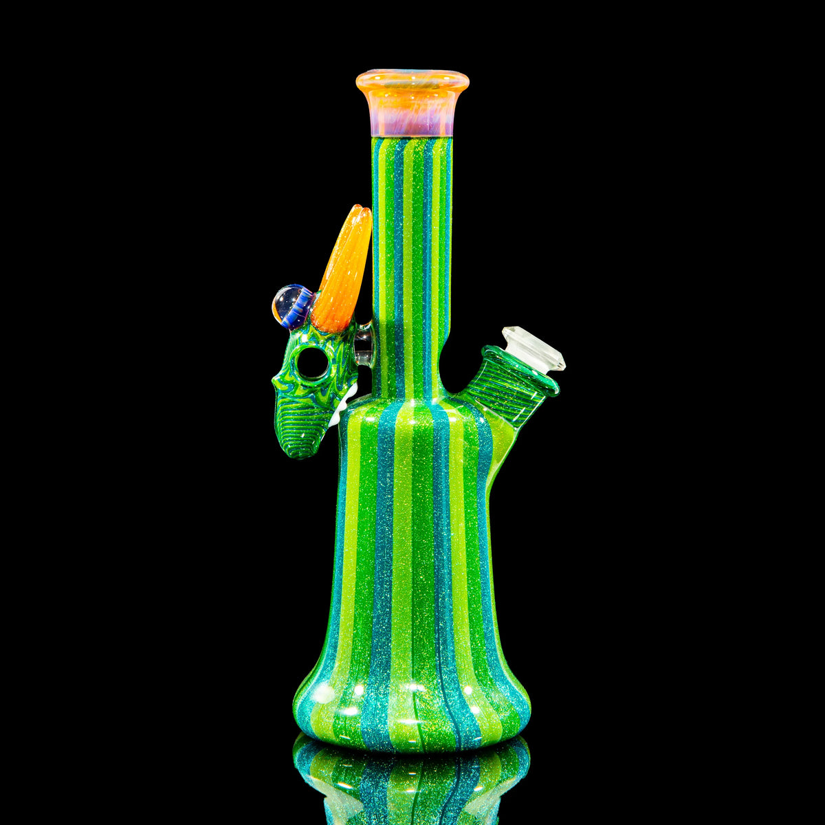 Colorful striped heady glass water pipe with sculpted horn accent on black background