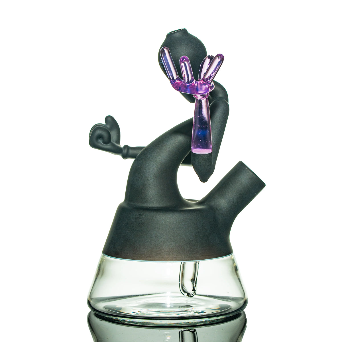 Artistic black and clear glass water pipe with a purple hand accent, heady glass piece